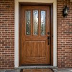 energy efficient fiberglass entry doors buying guide: Energy efficient fiberglass entry doors installed on a brick home