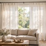 thermal white linen curtain panels for sale: White linen thermal curtain panels hanging in a bright living room