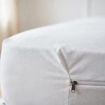 Dust mite mattress covers price comparison USA: white zippered mattress cover on a bed