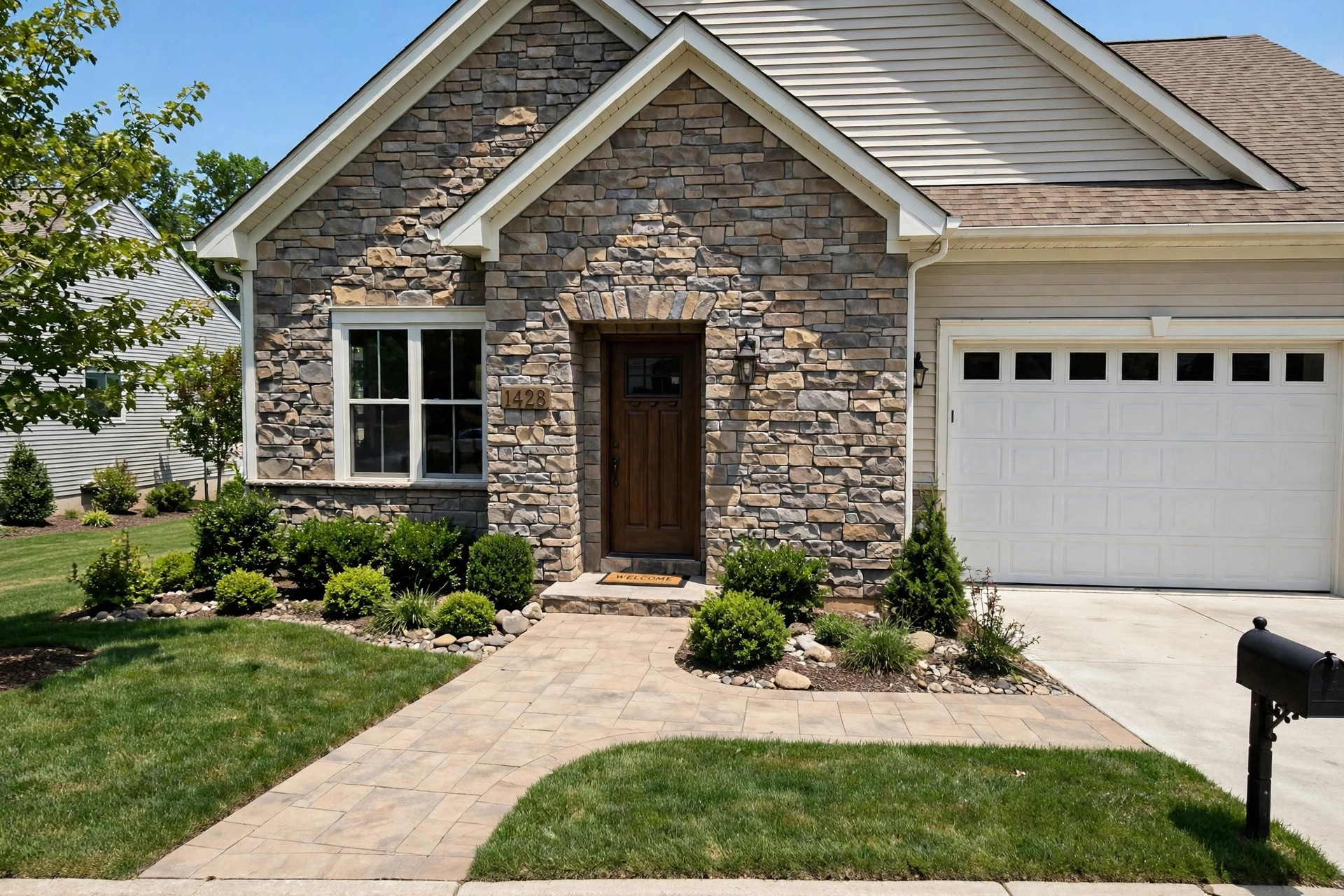 affordable stone veneer panels for sale: Natural stone veneer panels on the exterior wall of a home