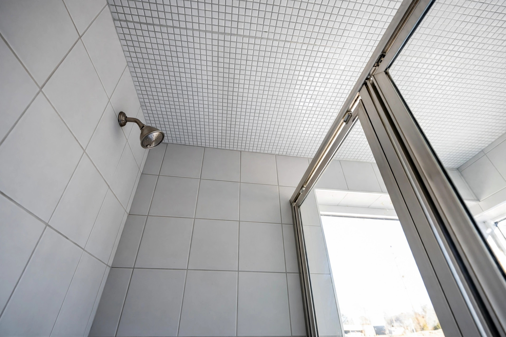 best tile for shower ceiling reviews usa: Small porcelain tiles on a shower ceiling in an American bathroom