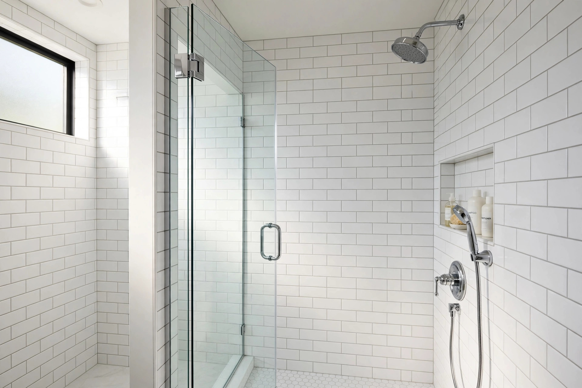 white grout maintenance tips for showers: Shower tile wall with bright white grout lines in an American home bathroom