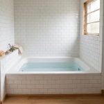 A compact soaking tub set in a small bathroom, with focus keyword best soaking tub for small bathroom usa