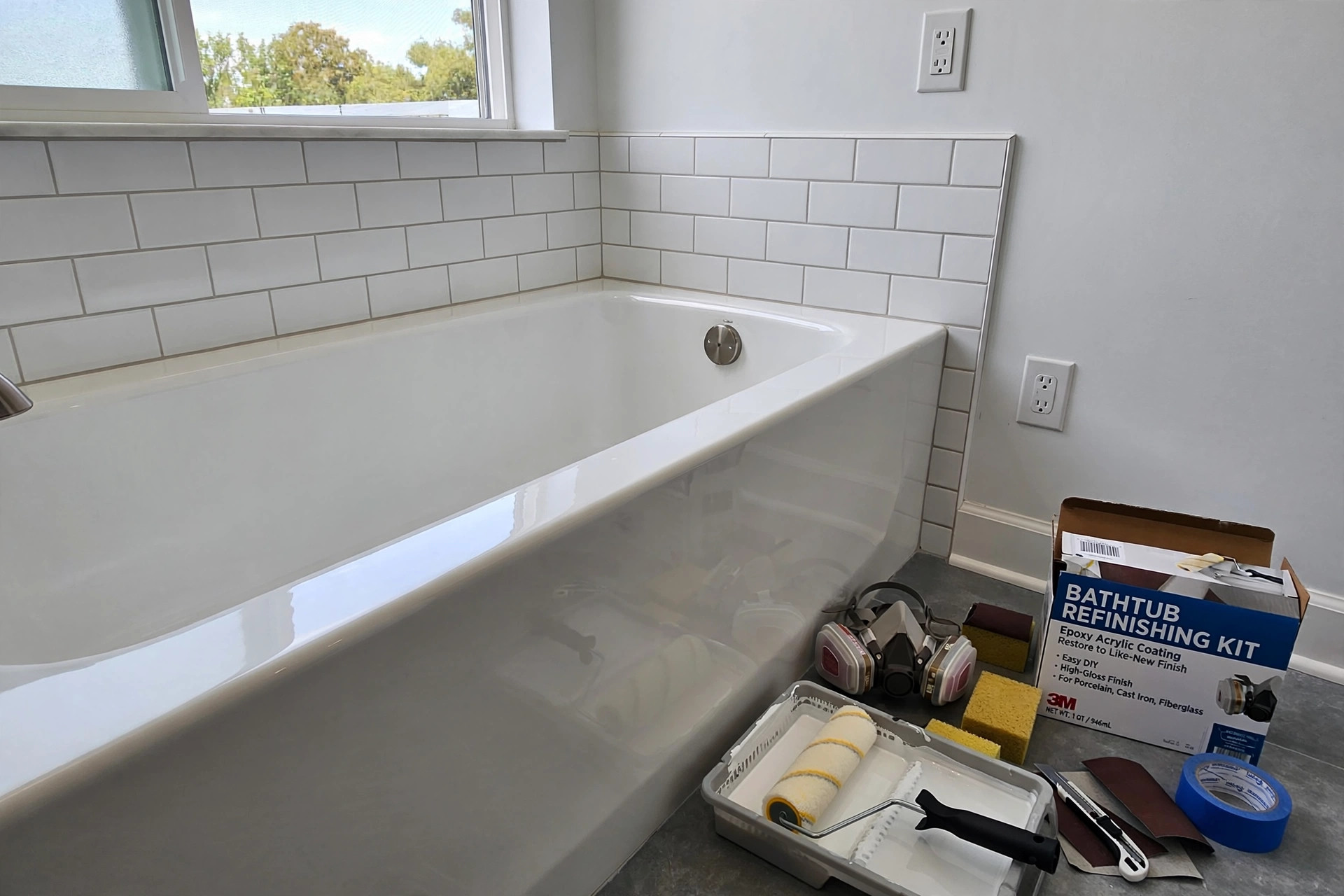 bathtub refinishing kits usa online deals: Bathtub refinishing kit supplies next to a clean refinished tub in an American bathroom