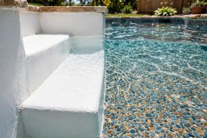 Pool Plaster vs Pebble Finish Comparison: A Plain Guide for Pool Owners
