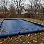 Pool with winter cover installed, following the pool closing checklist for fall season