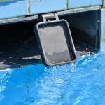 Pool skimmer with weir door showing how to clean a pool skimmer weir door
